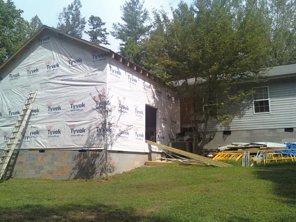 Tyvek wrapped gable on a new room addition beside an existing home in Hershey